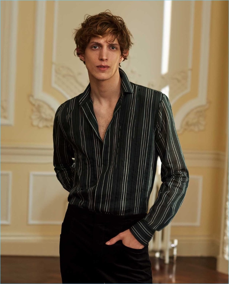An elegant vision, Xavier Buestel dons a striped Bottega Veneta shirt with Haider Ackermann velvet trousers.