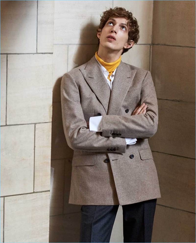 Stealing a contemplative moment, Xavier Buestel wears a Thom Sweeney double-breasted blazer with a Calvin Klein turtleneck. He also wears Incotex wool trousers and a Connolly shirt.