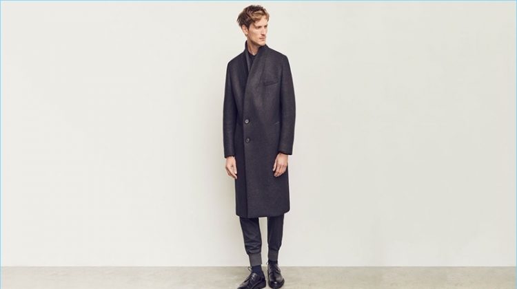 Front and center, Bastiaan Ninaber wears a double-breasted coat and track pants by Wooyoungmi. The top model also sports a Lemaire shirt and Lanvin derby shoes.