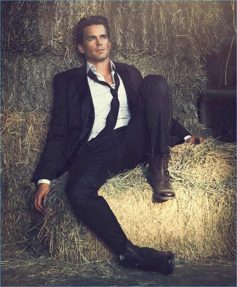 Connecting with Modern Luxury, Matt Bomer wears a BOSS suit with John Varvatos boots.