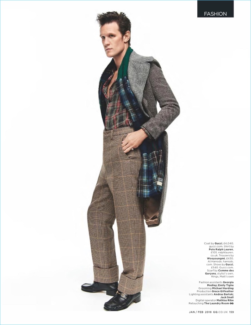 British GQ enlists Matt Smith for a fashion shoot. He wears a Gucci coat with a POLO Ralph Lauren shirt and Wooyoungmi trousers. Smith also sports a Comme des Garçons scarf and Gucci shoes.