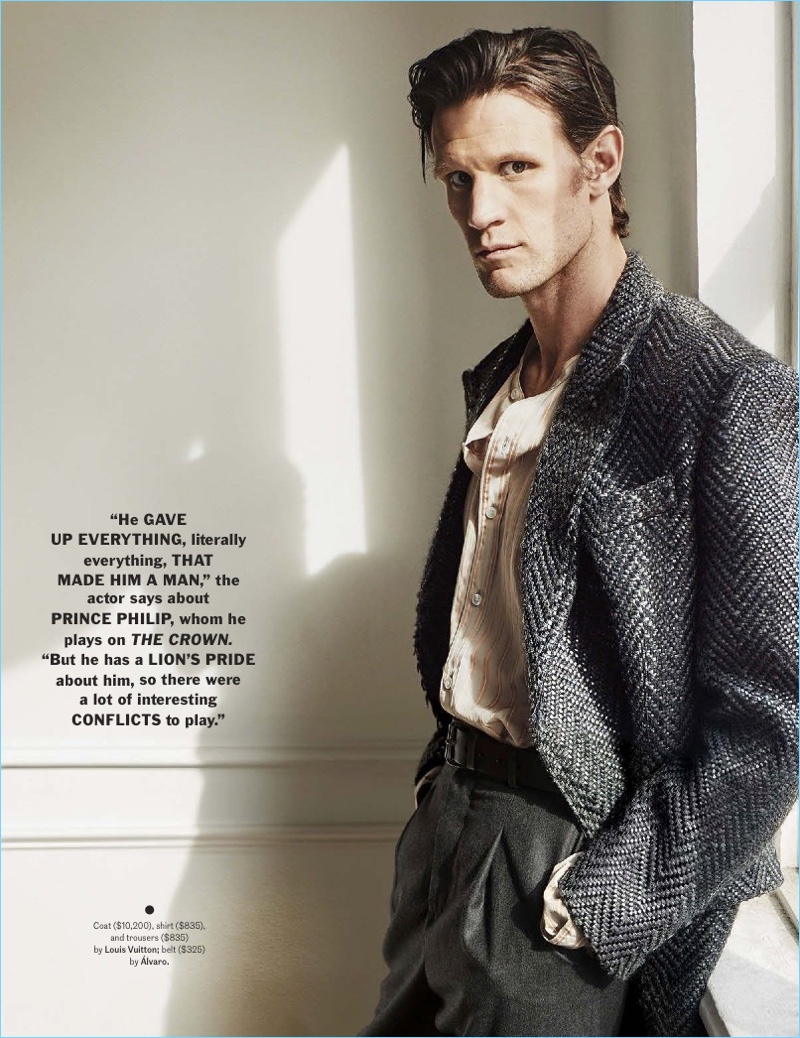 Delivering a side profile, Matt Smith wears a coat, shirt, and trousers by Louis Vuitton. An Alvaro belt completes his look.