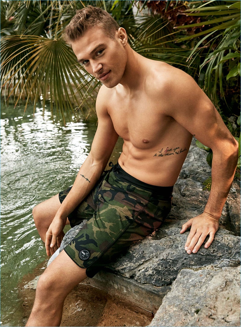 Making a camouflage statement, Matthew Noszka sports Vans board shorts.