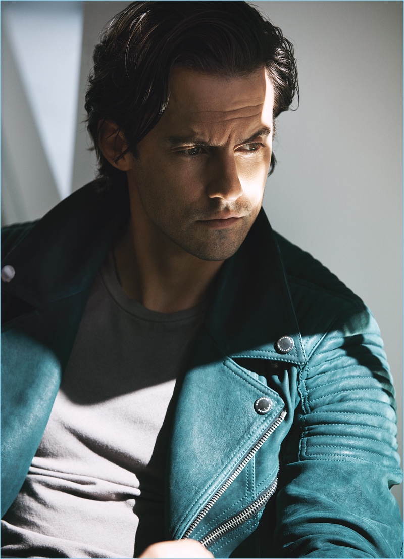 Starring in a photo shoot, Milo Ventimiglia sports a suede Burberry jacket with a Kenneth Cole t-shirt.