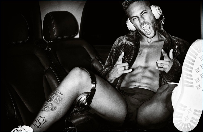 The life of the party, a shirtless Neymar Jr. poses for Man About Town.