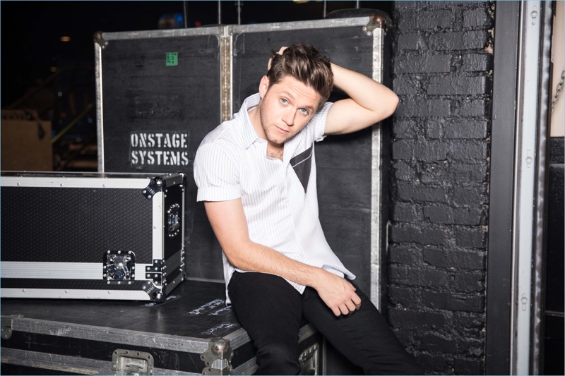 Singer Niall Horan sports a Dior Homme shirt with Buck Mason jeans.