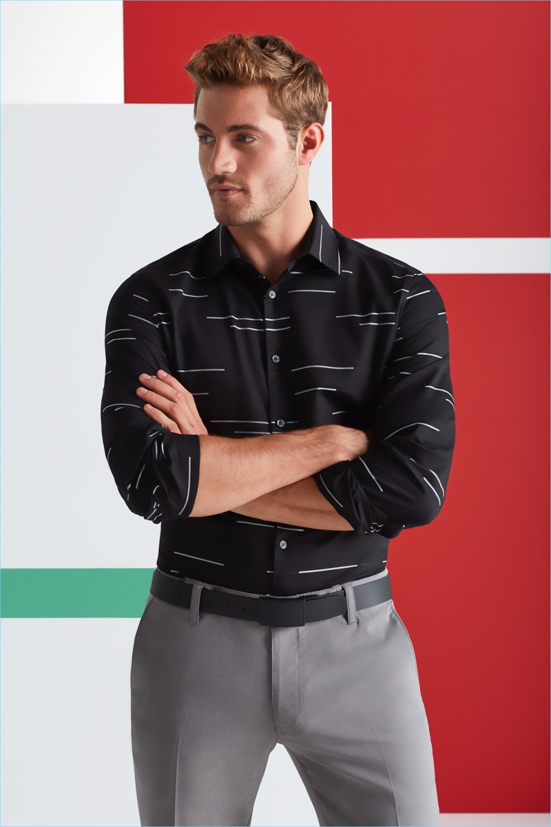 Office Holiday Party: Making a graphic statement, Will Higginson models a Perry Ellis horizontal stripe shirt with pants and a coated leather belt.