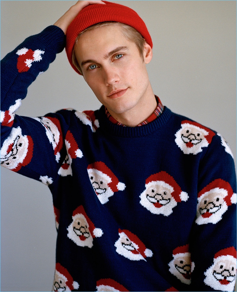Neels Visser models a holiday sweater by Pull & Bear.
