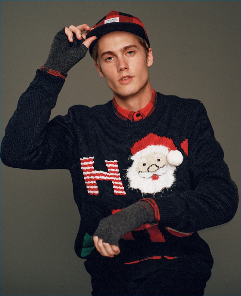 Model Neels Visser sports a holiday sweater from Pull & Bear.