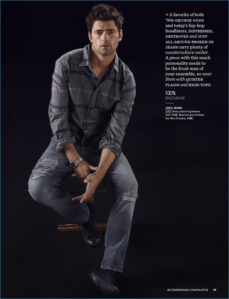 American model Sean O'Pry wears a Joe's jeans plaid shirt and slim-fit denim jeans.