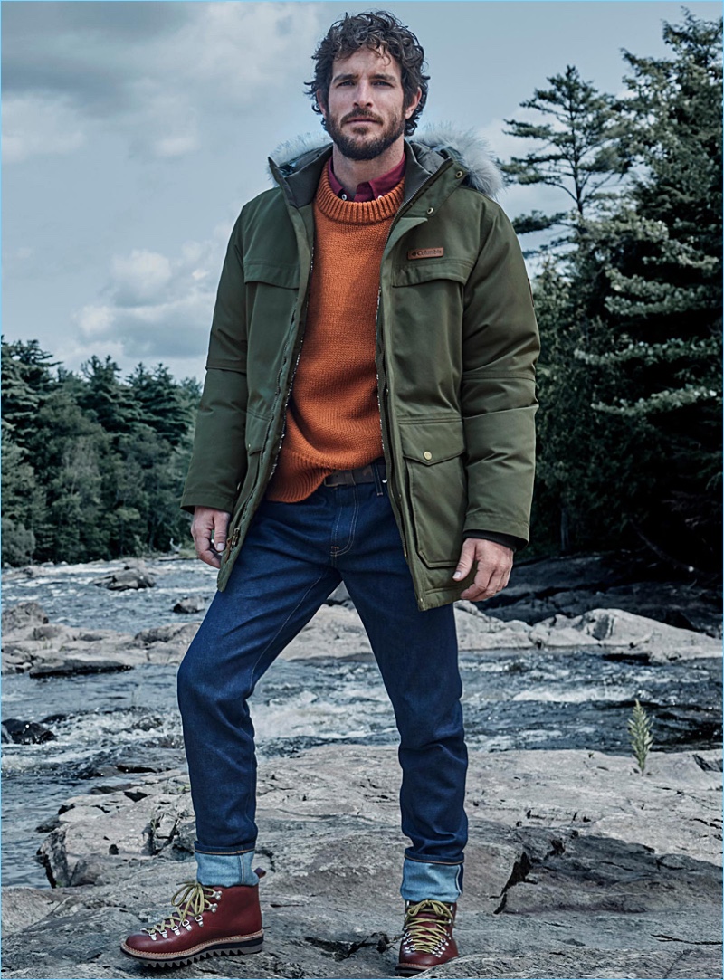 Front and center, Justice Joslin sports a Columbia parka in khaki. He also wears a LE 31 academy sweater, selvedge jeans, and oxford shirt. Fracap x Simons boots complete Justice's look.