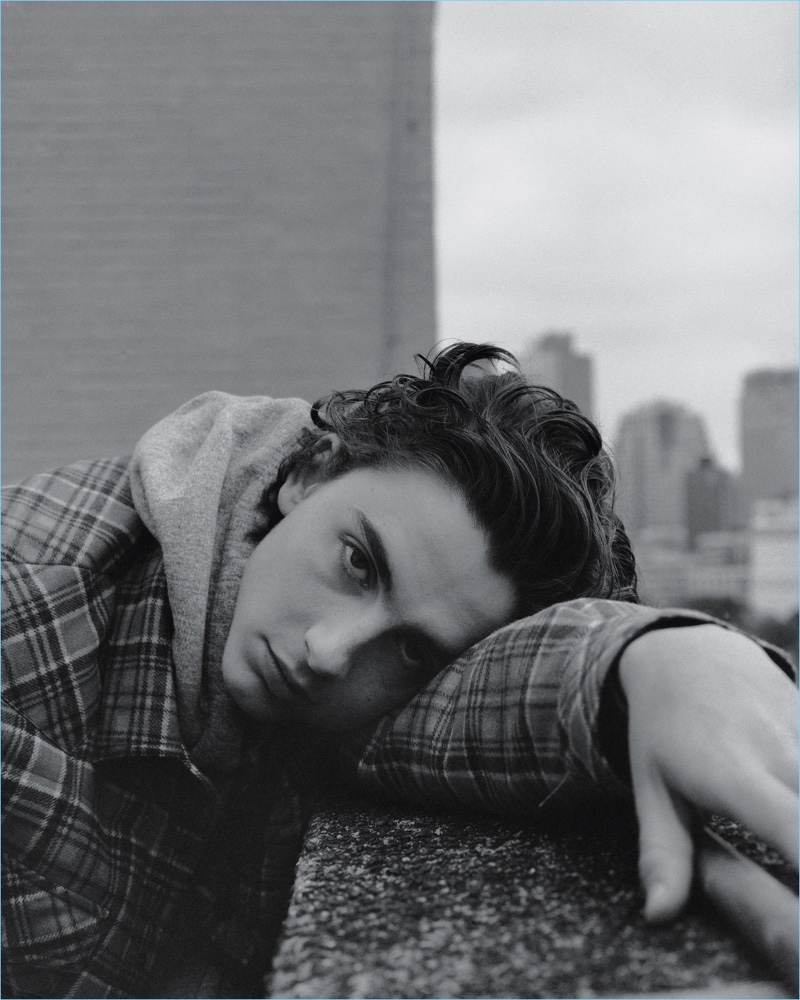 Timothée Chalamet wears a Moncler Grenoble shirt jacket with a vintage hoodie.
