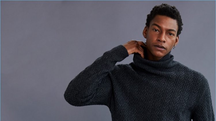 Ty Ogunkoya wears an Ermenegildo Zegna turtleneck sweater.