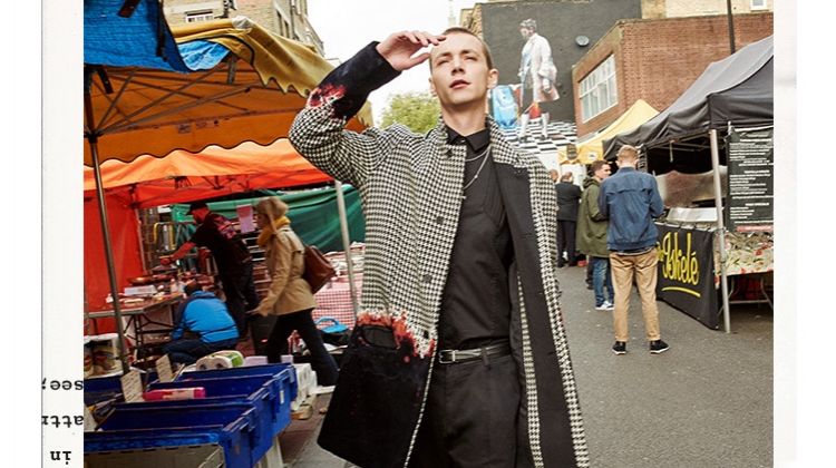 Yuri Pleskun wears a Haider Ackermann coat with a Les Hommes shirt. He also sports Jimmy Choo loafers, as well as a Dolce & Gabbana belt and trousers.