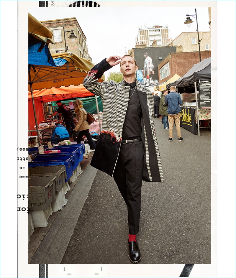 Yuri Pleskun wears a Haider Ackermann coat with a Les Hommes shirt. He also sports Jimmy Choo loafers, as well as a Dolce & Gabbana belt and trousers.