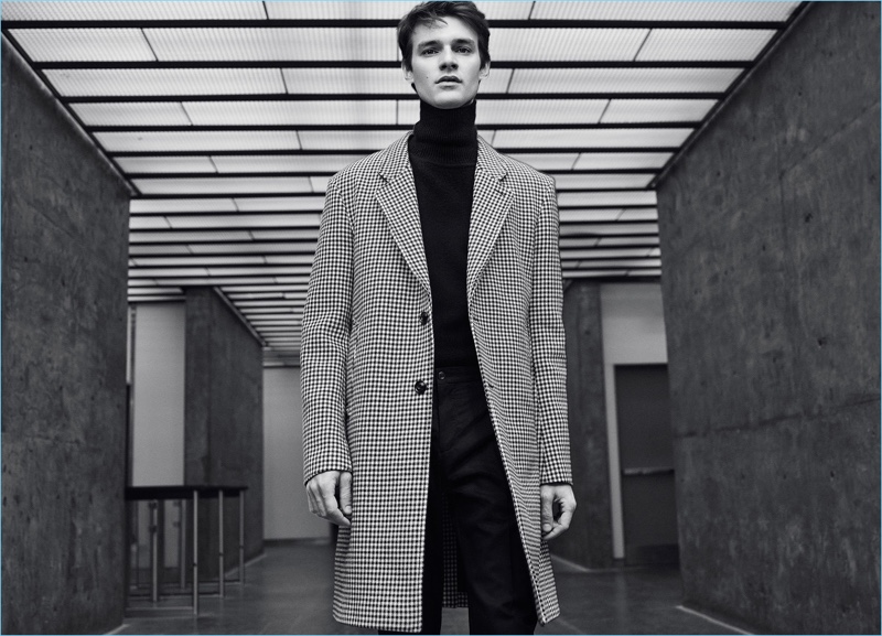 Douglas Neitzke is chic in a Zara Man check coat and turtleneck.