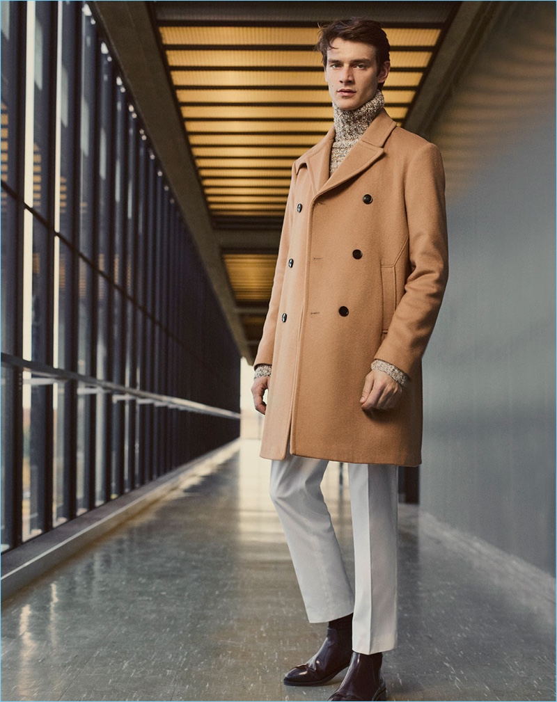 Brazilian model Douglas Neitzke wears a camel coat and turtleneck sweater from Zara Man.