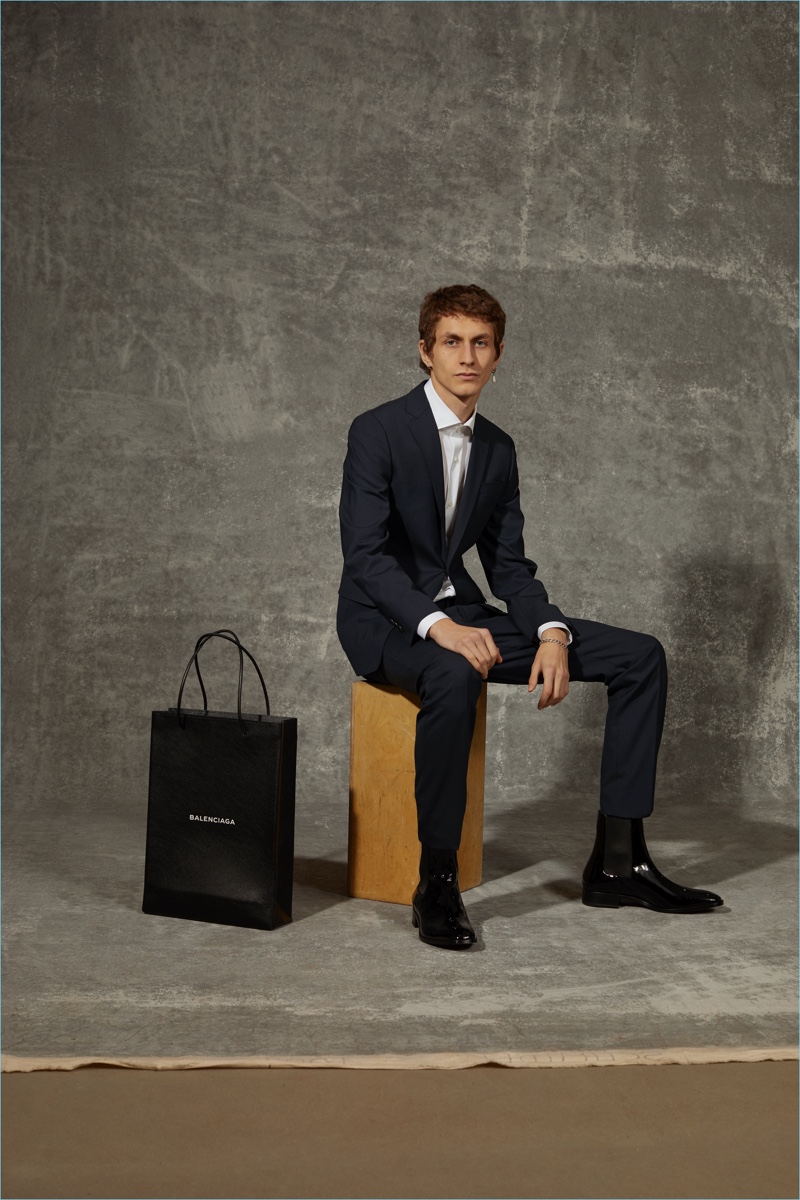 Henry Kitcher dons a Dsquared2 suit, Luigi Borelli shirt, and Christian Louboutin shoes for APROPOS Journal.