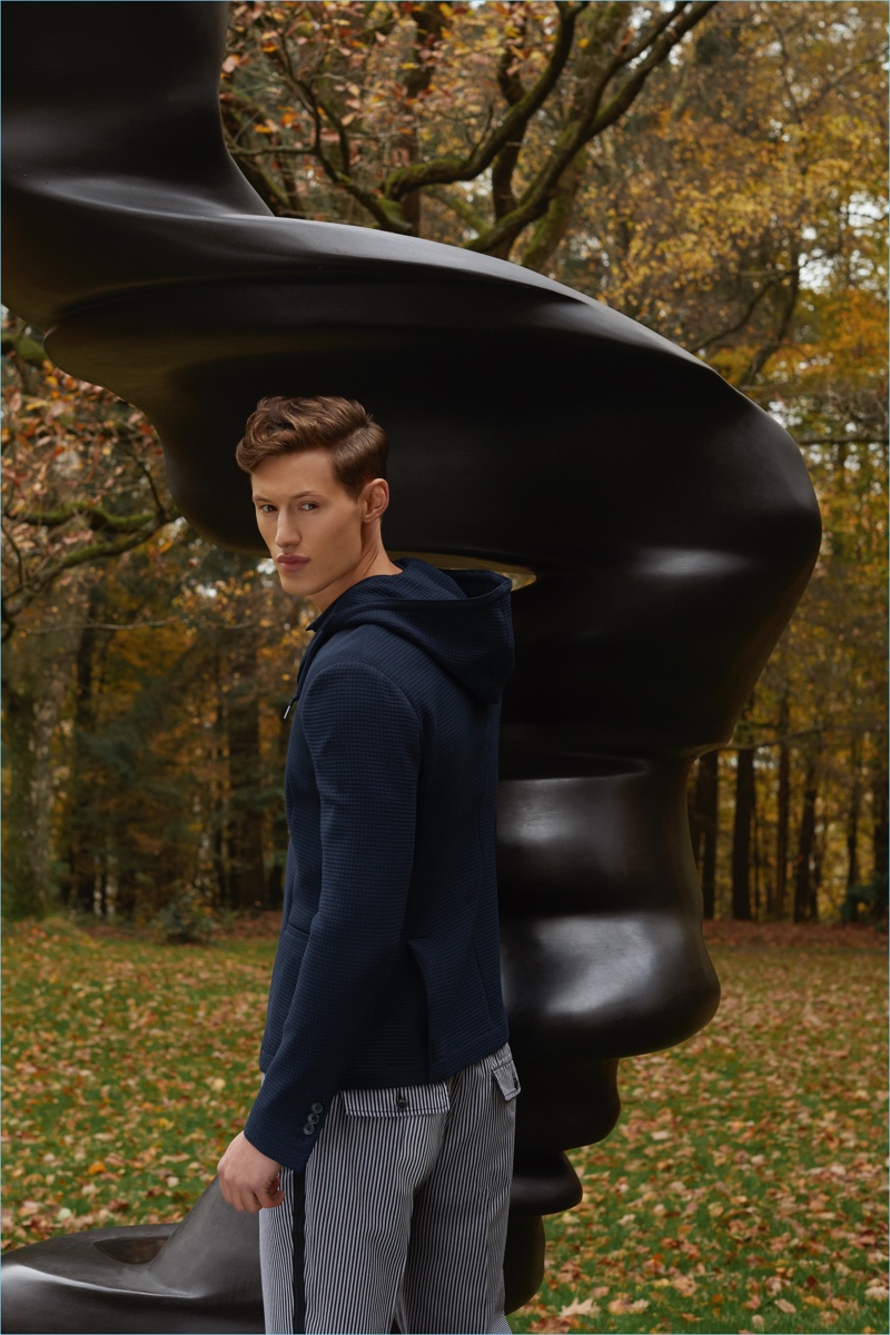 Model Dan Hyman wears an Emporio Armani jacket and pants.