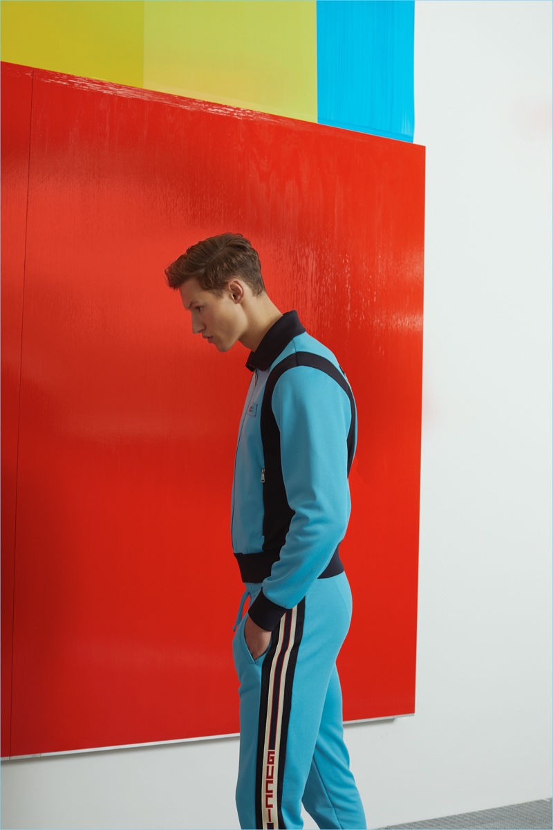 Dan Hyman wears a tracksuit by Gucci.