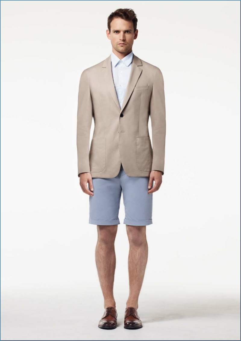 Guy Robinson dons a short suiting look by Aquascutum.