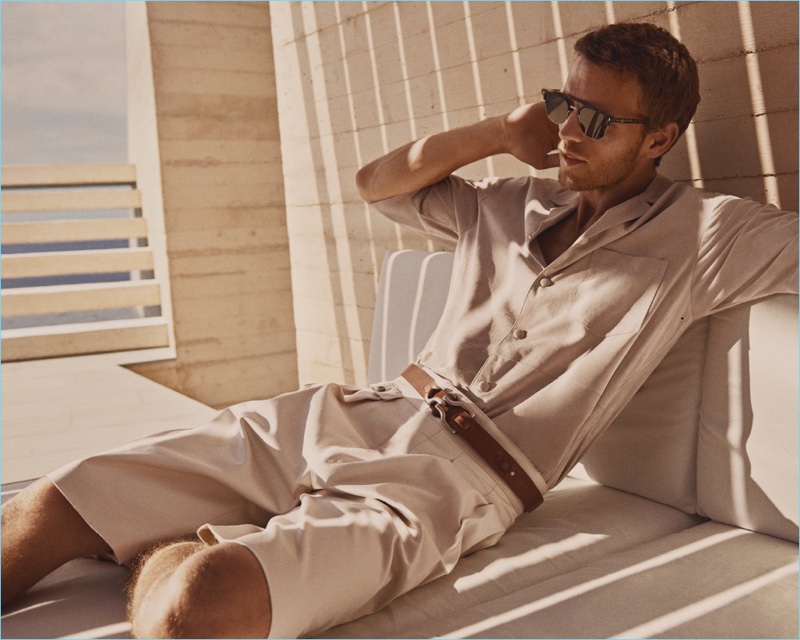 Sporting a summer look, Benjmain Eidem fronts BOSS' spring-summer 2018 campaign.