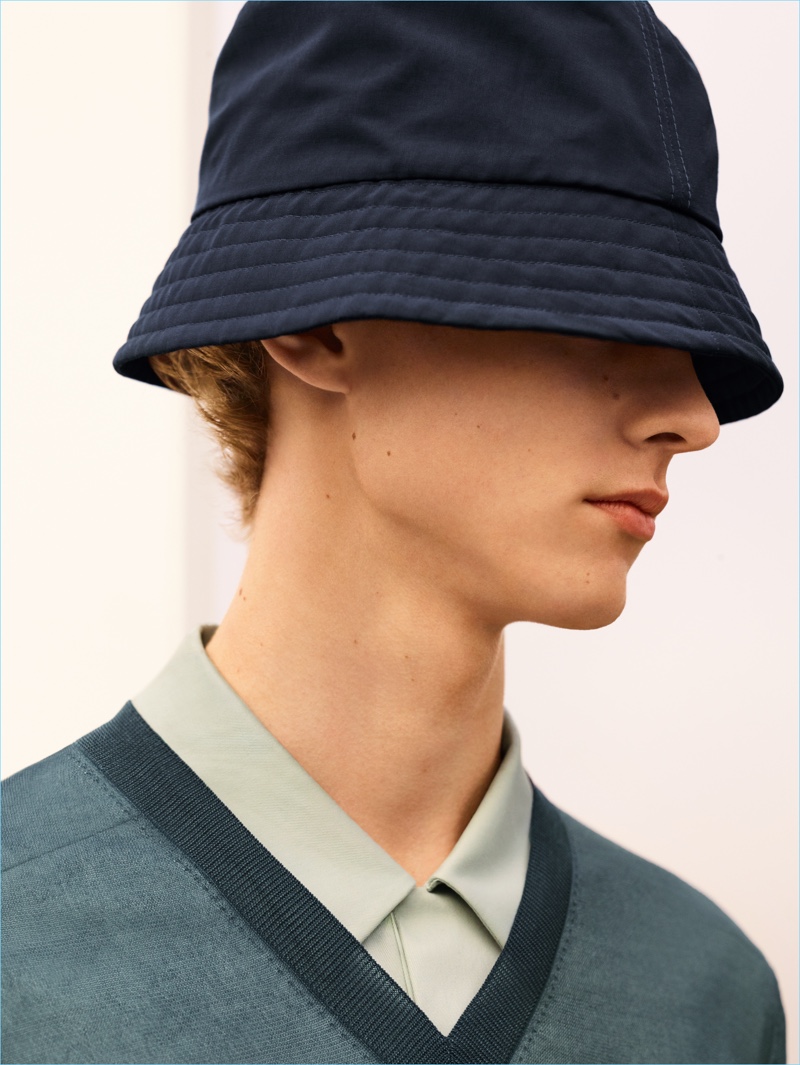 Sporting an on-trend bucket hat, Max Barczak appears in COS' spring-summer 2018 campaign.