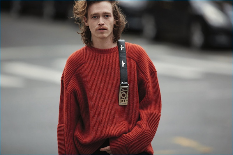 Actor Caleb Landry Jones wears a N. Hoolywood sweater with a vintage belt from What Goes Around Comes Around.