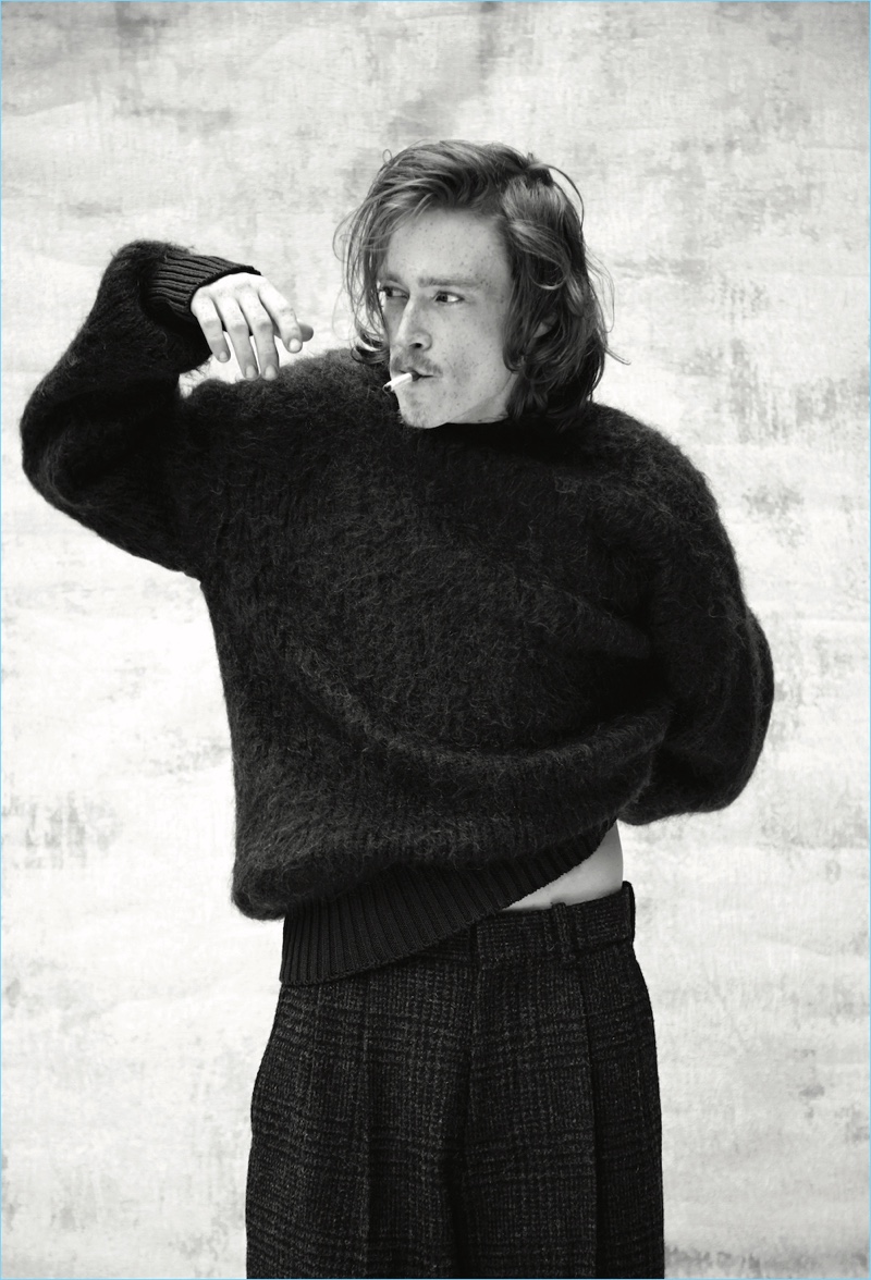 Starring in a new photo shoot, Caleb Landry Jones wears a sweater and trousers by N. Hoolywood.