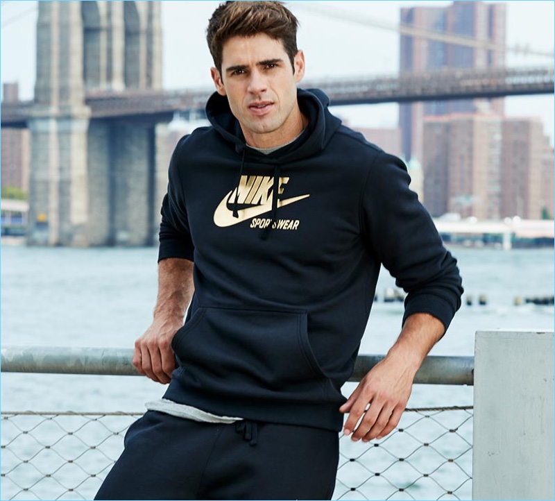 Chad White sports a Nike metallic logo sweatshirt from Macy's.