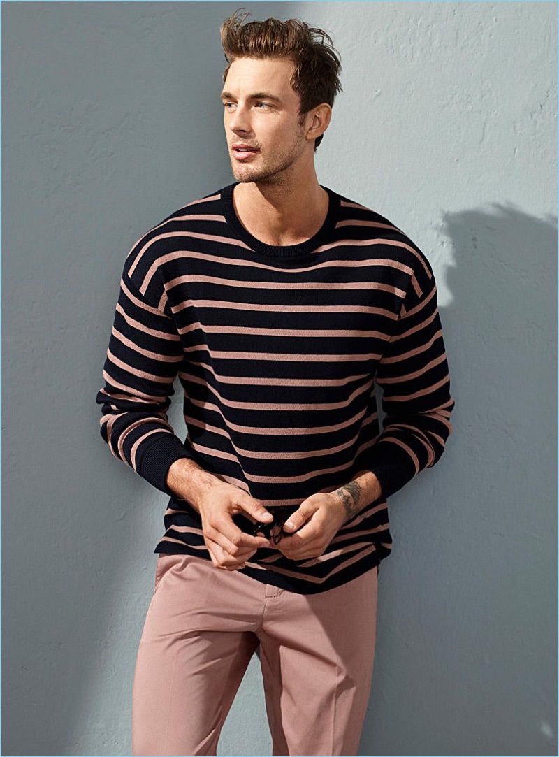 Keeping it simple, Christian Hogue wears a striped sweater and pink chinos by LE 31.