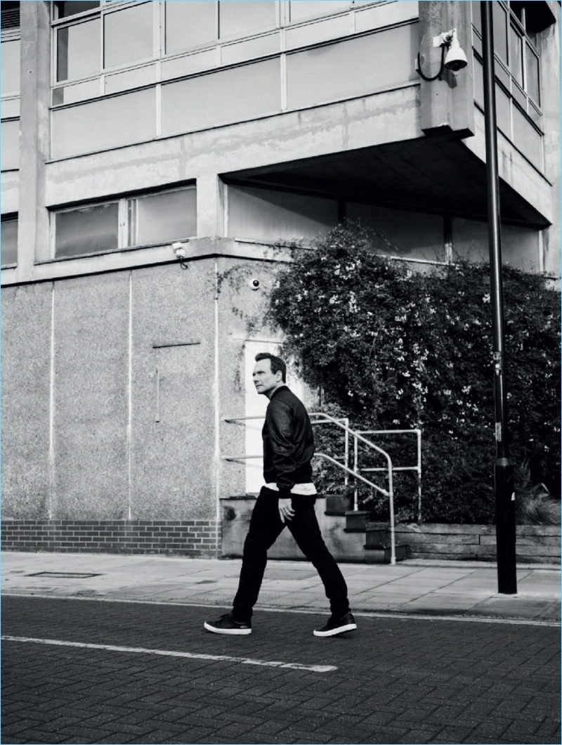 Stepping out, Christian Slater wears a look by Dior Homme with Common Projects sneakers.