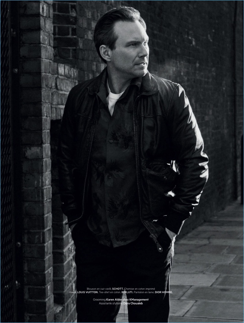 Starring in a new photo shoot, Christian Slater wears a Schott jacket with a Louis Vuitton shirt, Berluti t-shirt, and Dior Homme pants.