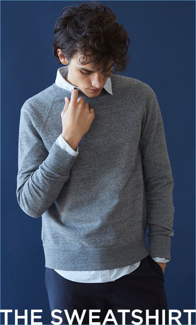 Elevate the sweatshirt with an oxford stripe shirt and suit trousers.