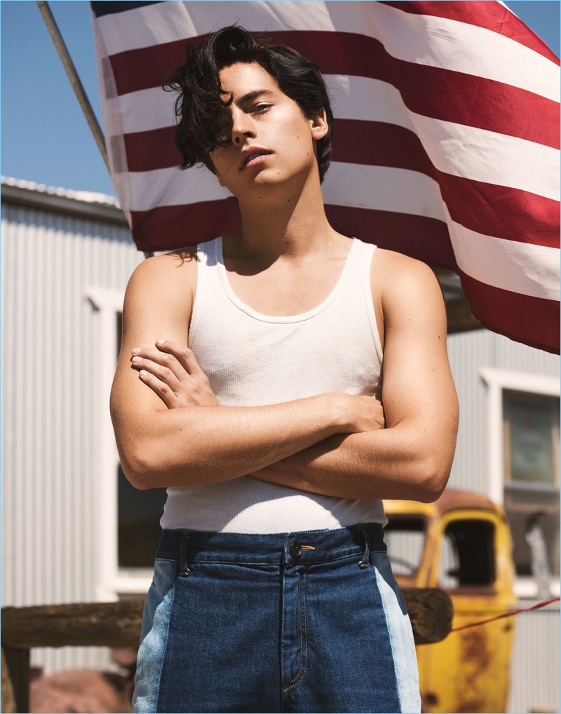 Cole Sprouse wears a Greg Lauren tank with Ports 1961 jeans.