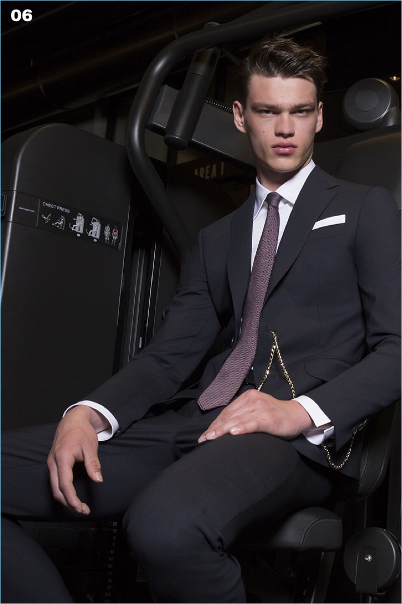 Model Filip Hrivnak takes to the gym in an elegant suit from Dsquared2.