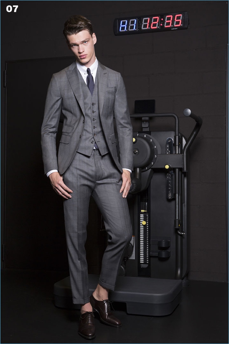 Wearing a three-piece suit, Filip Hrivnak reunites with Dsquared2.