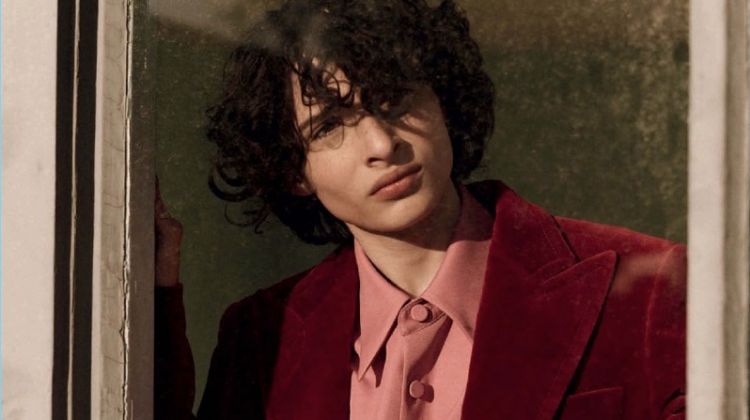 Appearing in a photo shoot, Finn Wolfhard wears a dapper Gucci look.