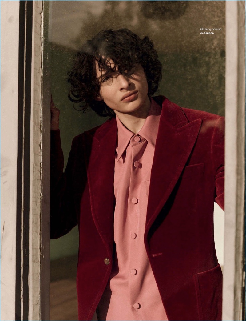 Appearing in a photo shoot, Finn Wolfhard wears a dapper Gucci look.