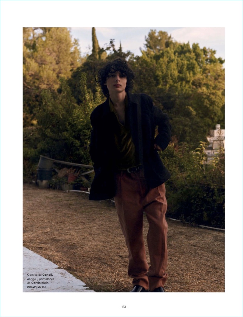 Stepping out, Finn Wolfhard wears a Canali shirt with a jacket and pants by Calvin Klein.