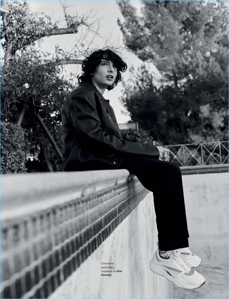 Pictured in black and white, Finn Wolfhard wears Dior Homme.