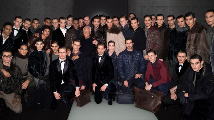 Designer Giorgio Armani appears in a picture with the models who walked for his namesake label.