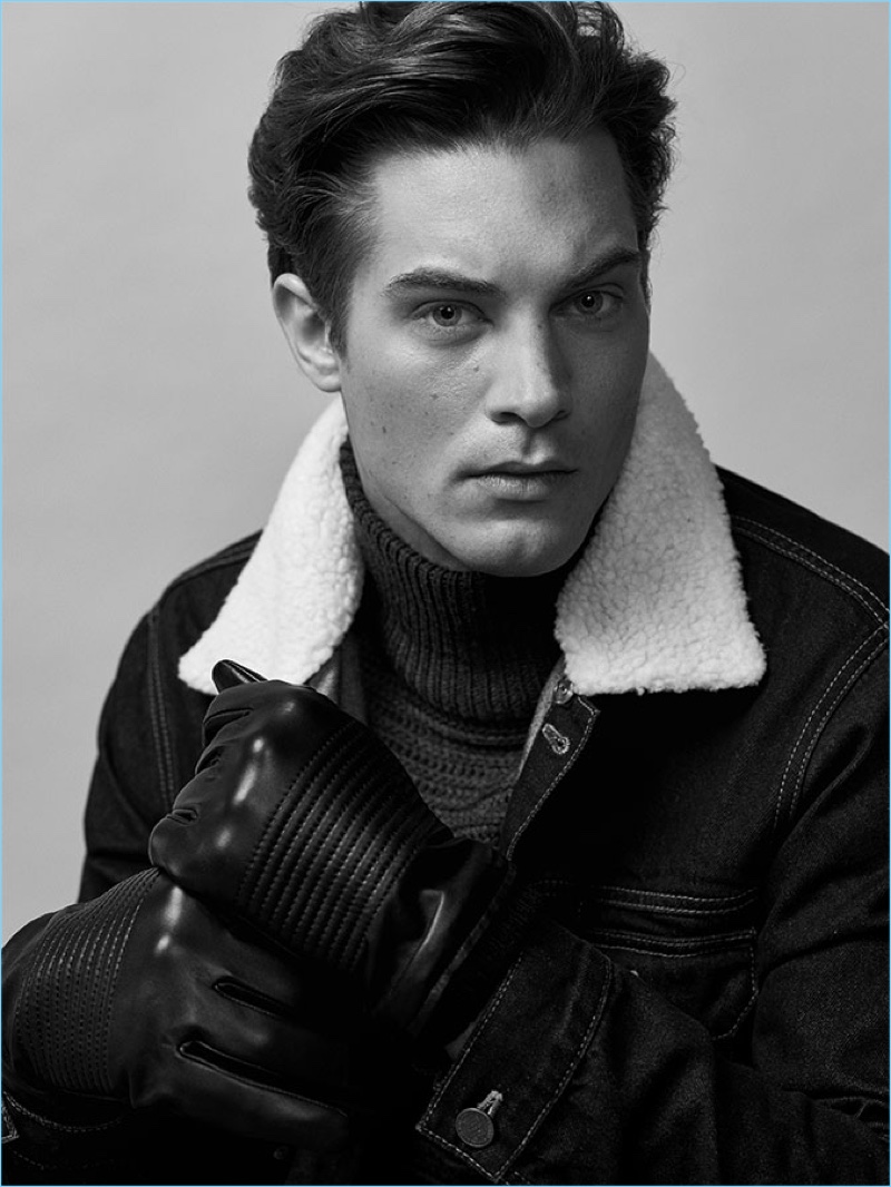 Model Greg Nawrat dons a turtleneck sweater and denim jacket from Reserved.