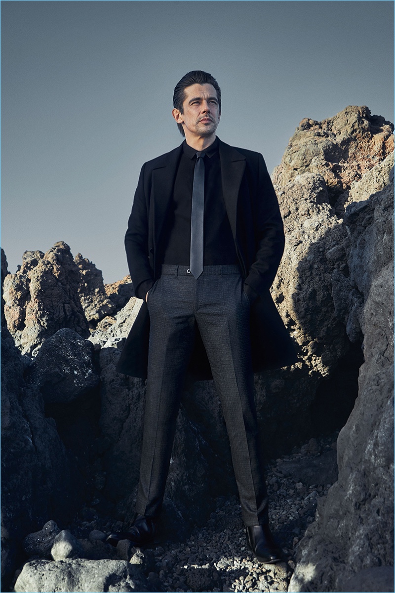 Clad in black, Werner Schreyer wears sharp trousers by Hiltl.