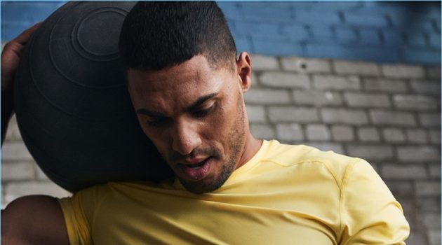 H&M Taps Ryan Tremaine Klarenbach for Activewear Edit Ryan Tremaine Klarenbach rocks a yellow sports shirt from H&M.