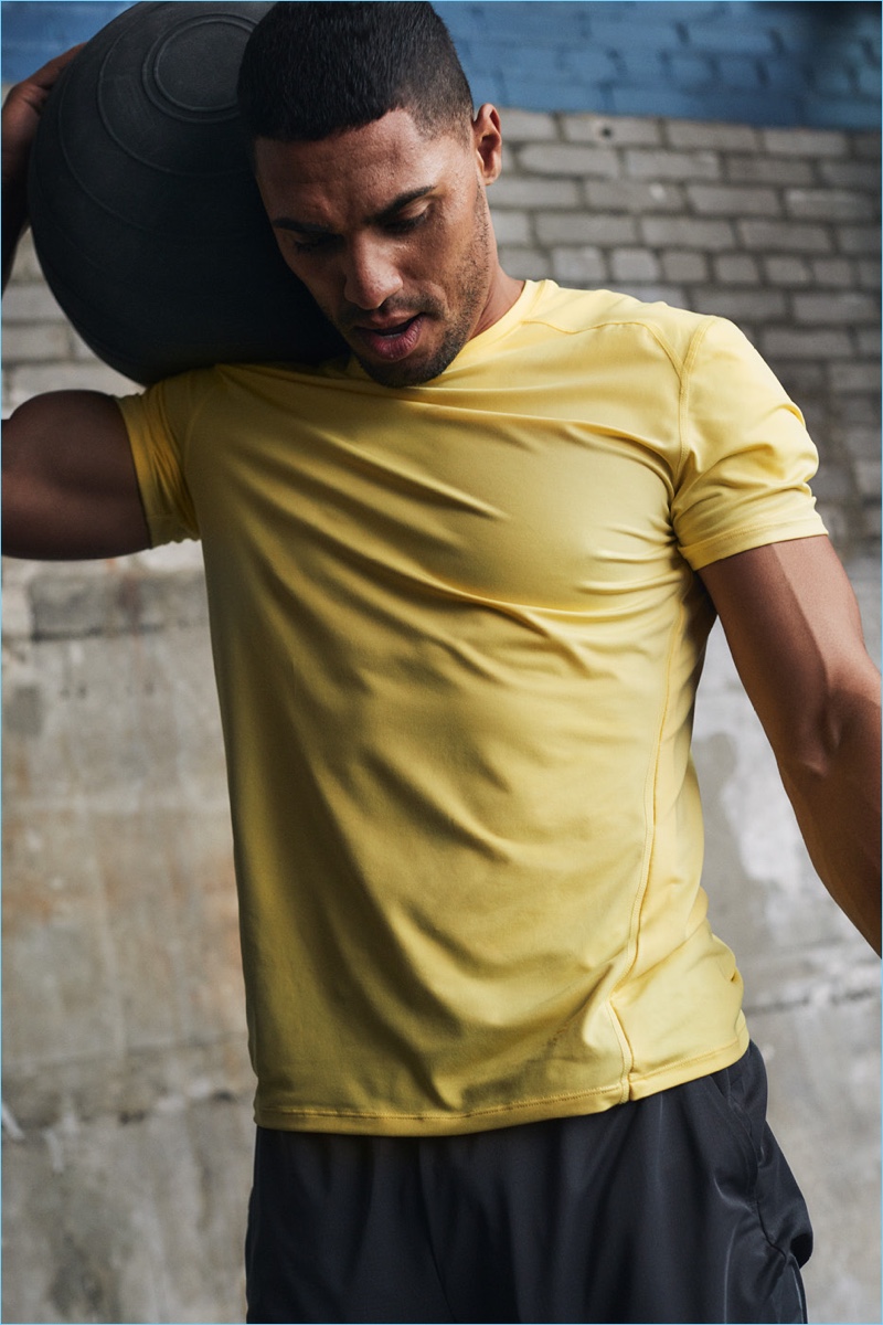 Ryan Tremaine Klarenbach rocks a yellow sports shirt from H&M.