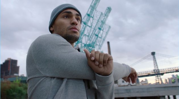 H&M Taps Ryan Tremaine Klarenbach for Activewear Edit Working out, Ryan Tremaine Klarenbach wears a H&M hooded sports shirt.