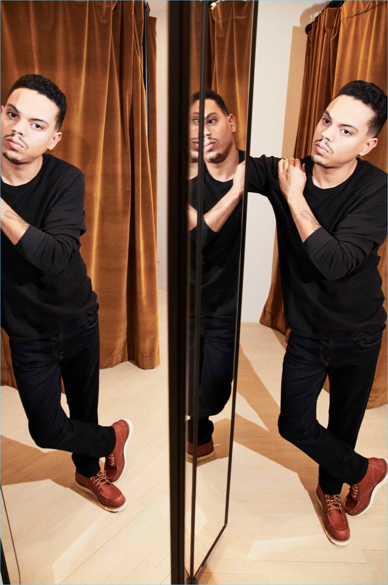 Clad in black, Evan Ross wears J Brand Tyler slim-fit jeans in Wilson.