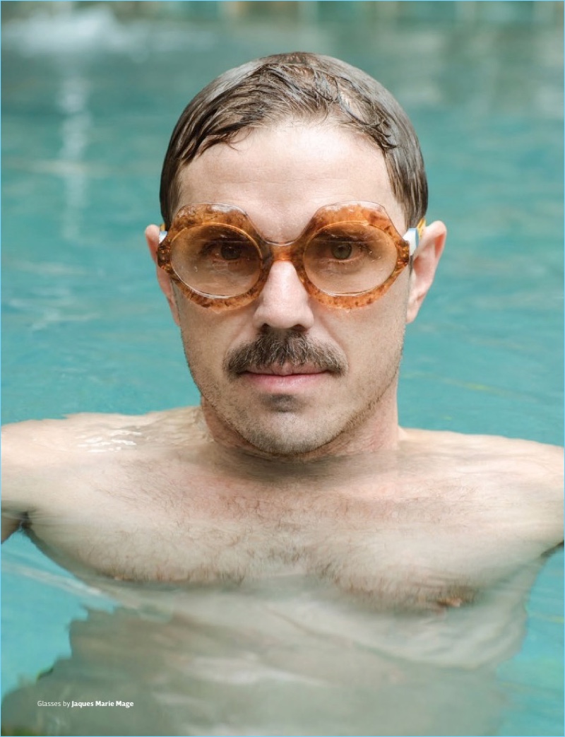 Taking a dip, Jake Shears wears Jaques Marie Mage glasses.