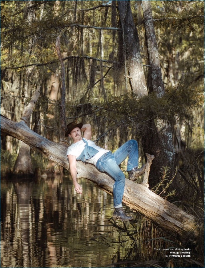 Hanging out on a tree, Jake Shears wears a casual look by Levi's Vintage Clothing. He also sports a Worth & Worth hat.